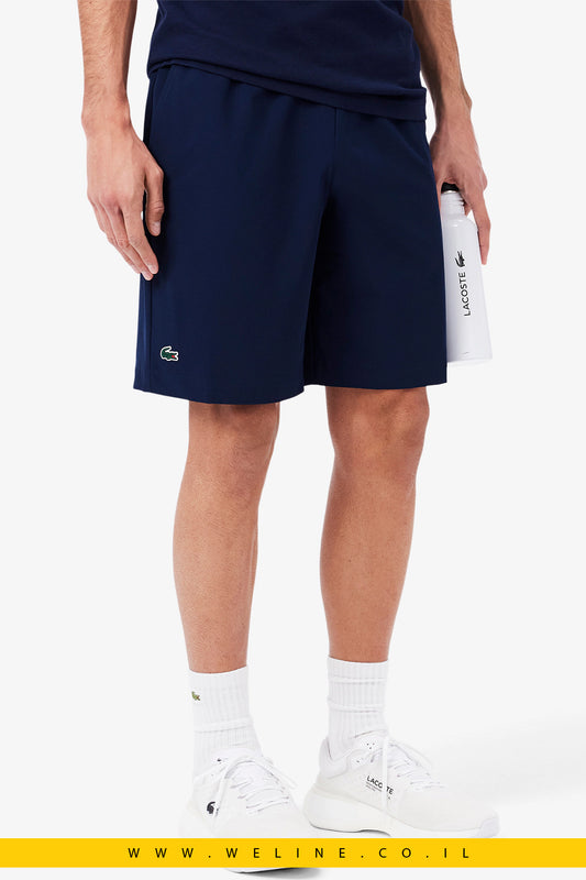 מכנסי טניס לגברים בגזרת רגולר עם טכנולוגיית Ultra Dry – בצבע כחול מבית Lacoste