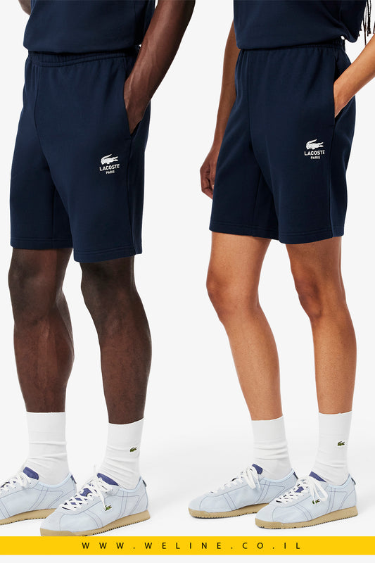 מכנסי פליס כותנה מודפסים יוניסקס בצבע כחול מבית Lacoste