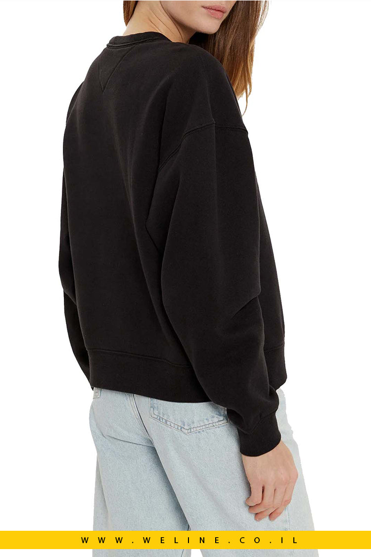 סווטשירט Tommy Jeans Nw Bxy Glitter Varsity Crew בצבע שחור