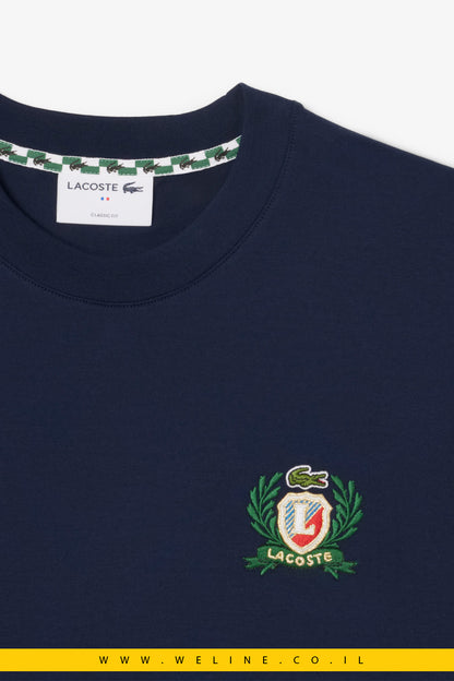 חולצת טי רקומה בעיצוב צרפתי לגברים מבית Lacoste – כחול