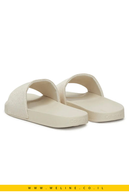 כפכפי נשים מבית Calvin Klein – דגם Pool Slide בצבע אקרו
