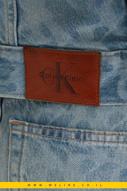 כותרת ג’קט ג’ינס נשים 90s Trucker AOP – Calvin Klein | צבע תכלת Lt Playbill - WELINE.CO.IL