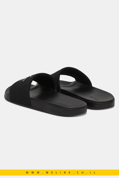 כפכפי סלייד נשים Calvin Klein Canvas Contoured – צבע שחור/לבנדר עדין - WELINE.CO.IL