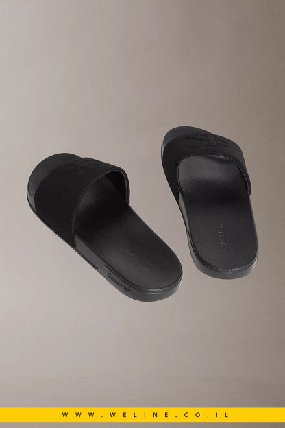 כפכפי סלייד גברים Calvin Klein Nemo Canvas Contoured – צבע שחור מלא (Triple Black) - WELINE.CO.IL