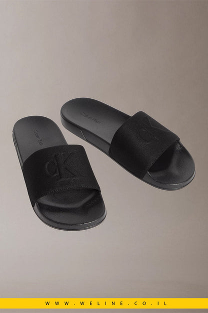 כפכפי סלייד גברים Calvin Klein Nemo Canvas Contoured – צבע שחור מלא (Triple Black) - WELINE.CO.IL